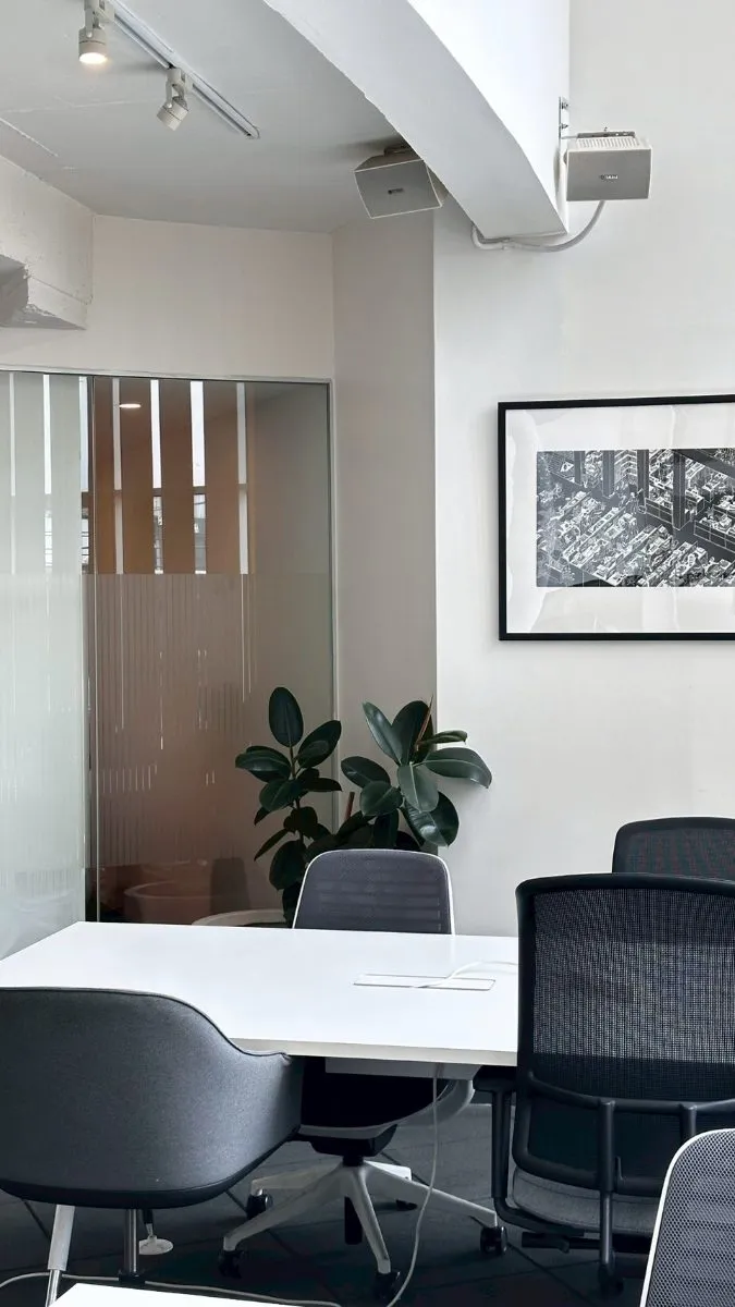Meeting room with framed cityscape artwork